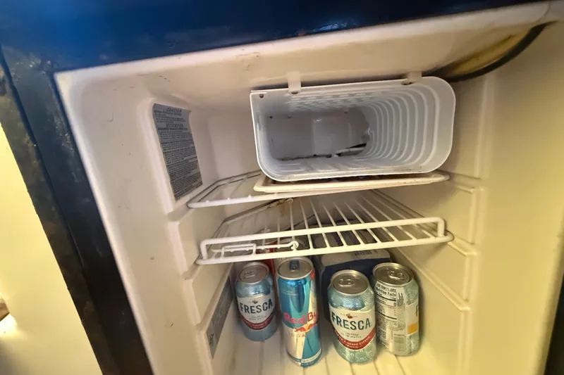 Slide: The Image of Mini fridge inside 2007 Hydra-Sports Vector 2900 VX with drinks, including Fresca and Red Bull. - 126