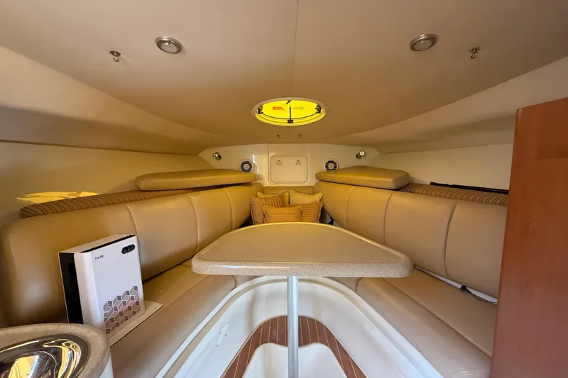 Slide: The Image of 2007 Hydra-Sports Vector 2900 VX cabin interior with beige seating and table. - 128