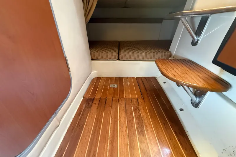 Slide: The Image of 2007 Hydra-Sports Vector 2900 VX cabin interior with wooden flooring and seating area. - 133