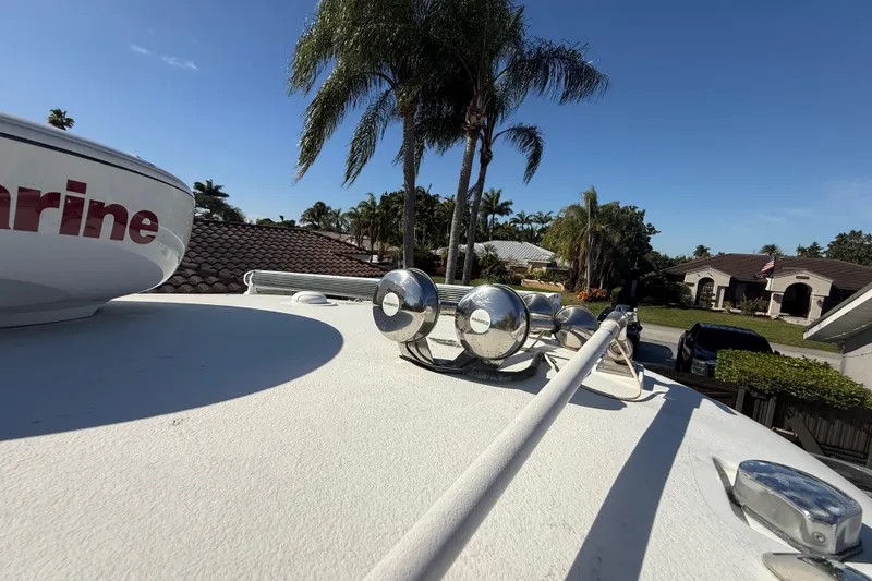 Slide: The Image of 2007 Hydra-Sports Vector 2900 VX boat deck with palm trees and houses in the background. - 144