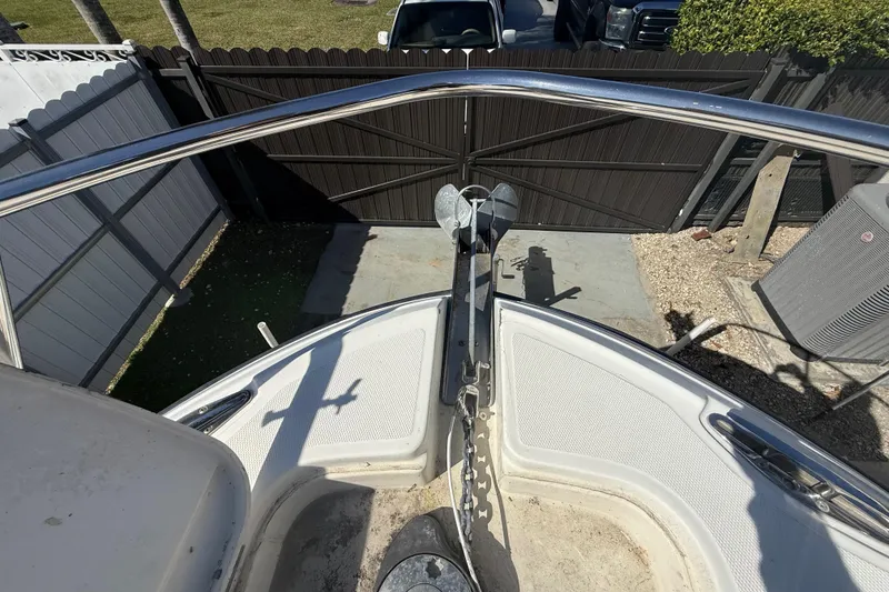 Slide: The Image of 2007 Hydra-Sports Vector 2900 VX boat bow with anchor and railing in a driveway. - 151