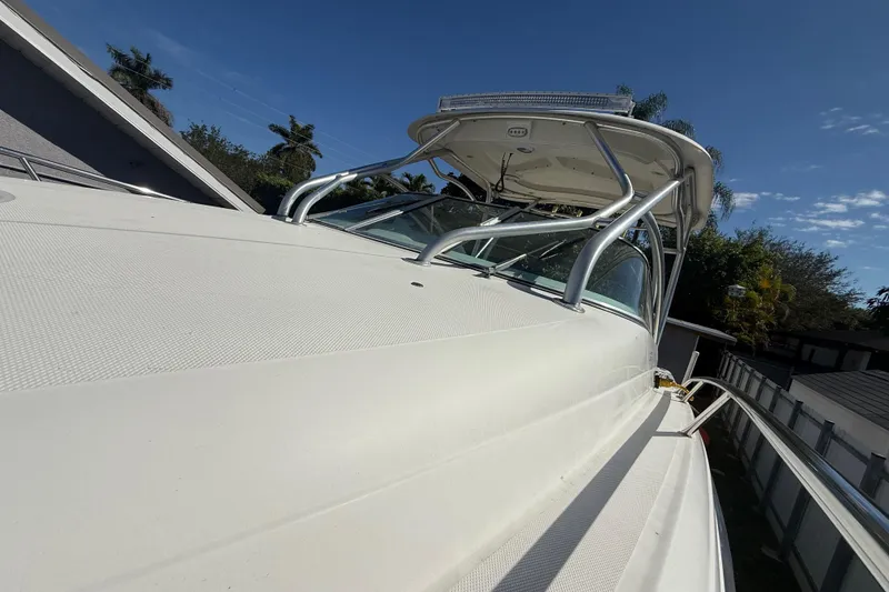 Slide: The Image of 2007 Hydra-Sports Vector 2900 VX boat, sleek design, clear sky background. - 152