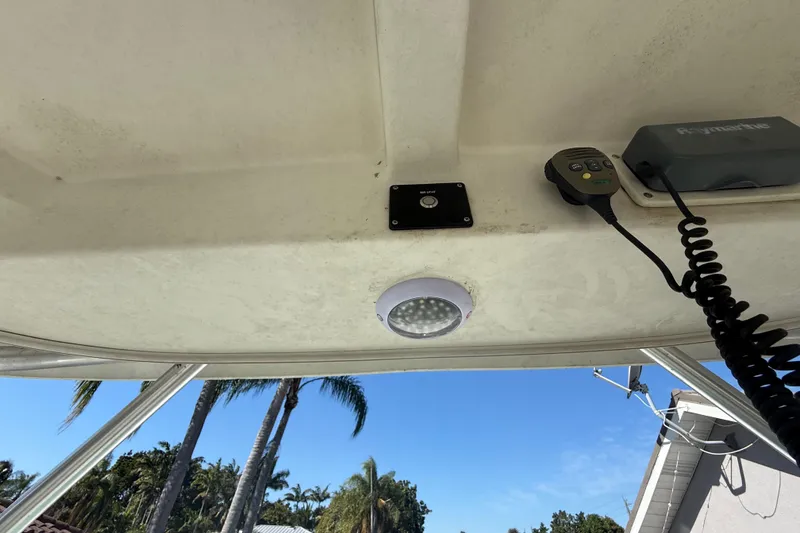 Slide: The Image of 2007 Hydra-Sports Vector 2900 VX boat interior with control panel and palm trees in background. - 161