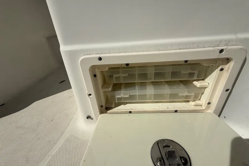 Slide: The Image of 2007 Hydra-Sports Vector 2900 VX storage compartment with tackle boxes, open lid. - 165