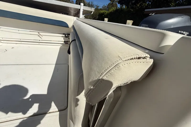 Slide: The Image of 2007 Hydra-Sports Vector 2900 VX boat interior with worn upholstery and Yamaha engine. - 171