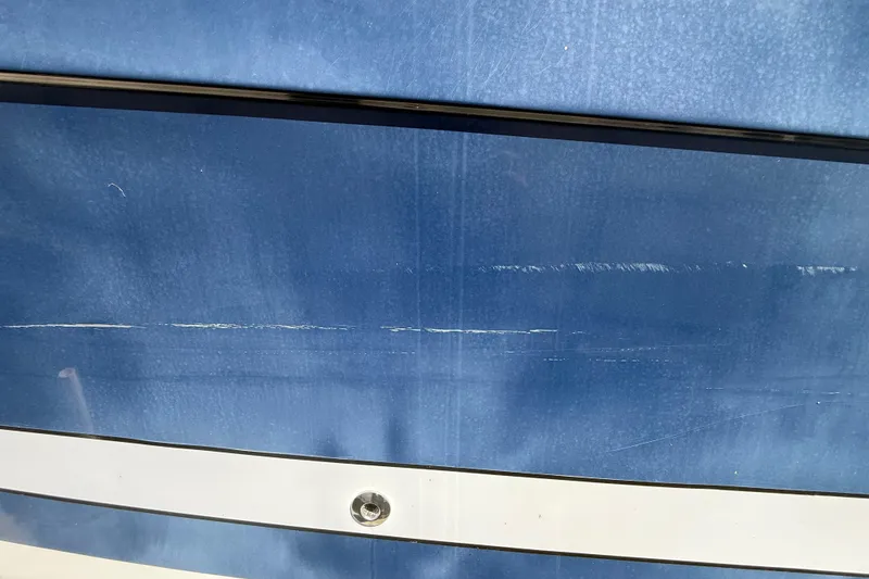 Slide: The Image of Close-up of 2007 Hydra-Sports Vector 2900 VX boat hull with visible scratches. - 173