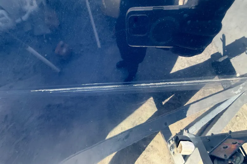 Slide: The Image of 2007 Hydra-Sports Vector 2900 VX boat hull with visible scratches and reflections. - 181