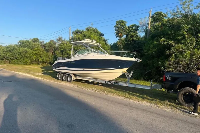 The Image of 2007 Hydra-Sports Vector 2900 VX boat on trailer, parked outdoors. - 2