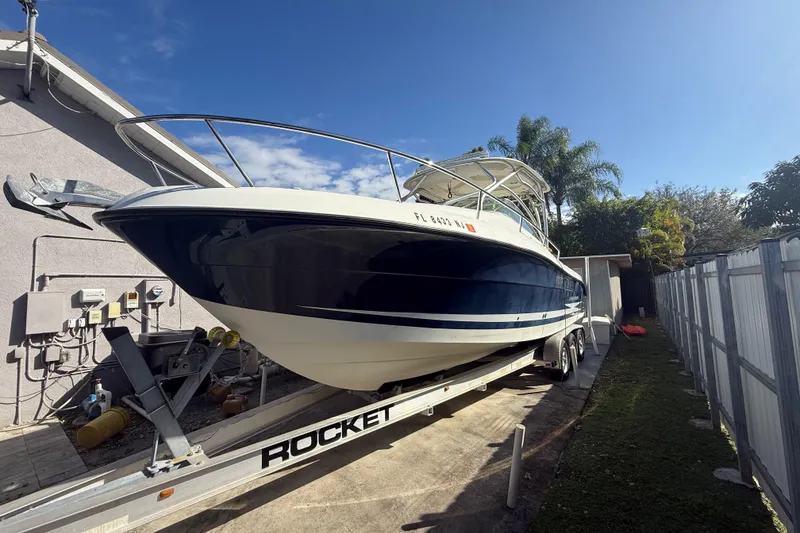 Slide: The Image of 2007 Hydra-Sports Vector 2900 VX boat on trailer, parked outdoors under clear sky. - 31
