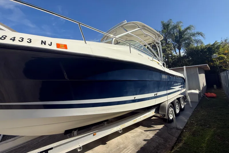 Slide: The Image of 2007 Hydra-Sports Vector 2900 VX boat on trailer, parked outdoors under clear sky. - 33