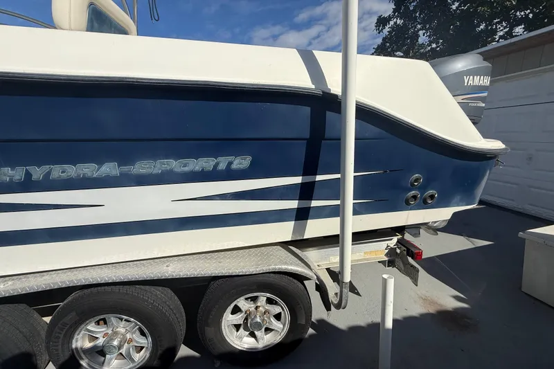 Slide: The Image of 2007 Hydra-Sports Vector 2900 VX boat on trailer, featuring Yamaha engine, parked outdoors. - 38