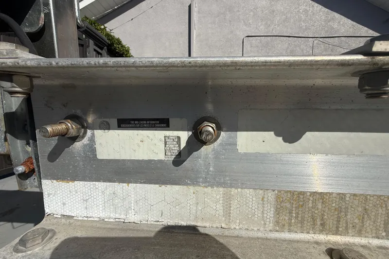 Slide: The Image of Close-up of 2007 Hydra-Sports Vector 2900 VX boat trailer bolts and metal frame. - 45