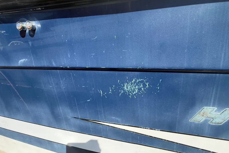 Slide: The Image of 2007 Hydra-Sports Vector 2900 VX boat with visible scratches on blue hull. - 47