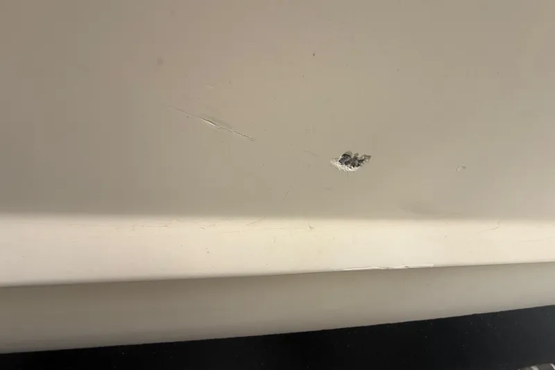 Slide: The Image of Close-up of a 2007 Hydra-Sports Vector 2900 VX hull with visible damage. - 53