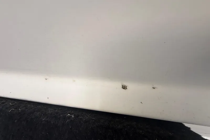 Slide: The Image of 2007 Hydra-Sports Vector 2900 VX hull with visible surface damage. - 54