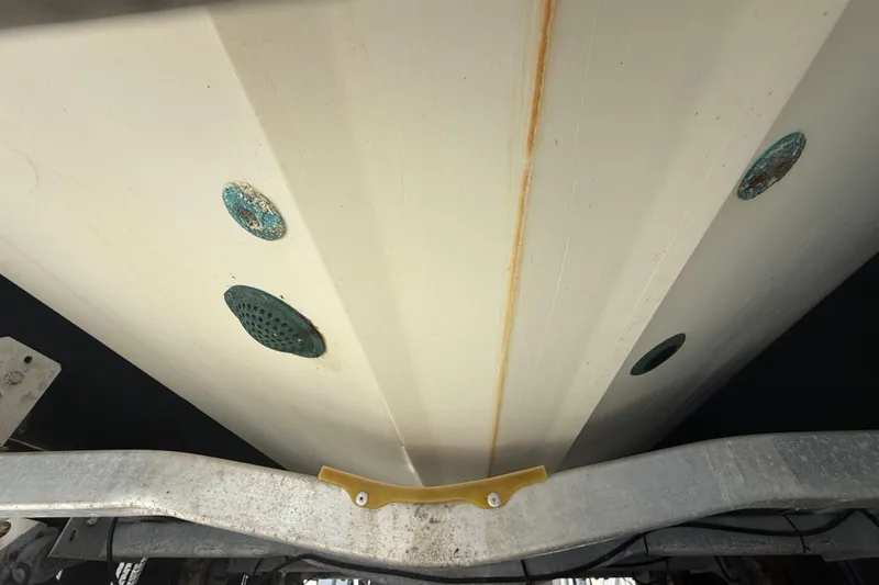Slide: The Image of 2007 Hydra-Sports Vector 2900 VX boat hull underside with visible drain holes. - 56
