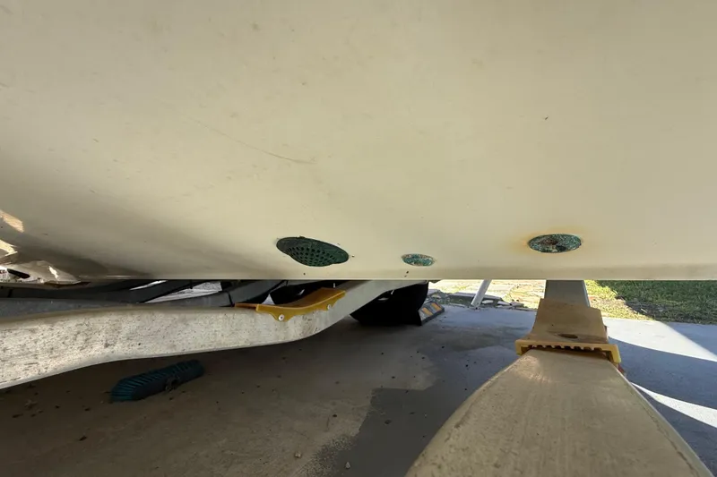 Slide: The Image of 2007 Hydra-Sports Vector 2900 VX boat hull on trailer, showing drainage outlets. - 64