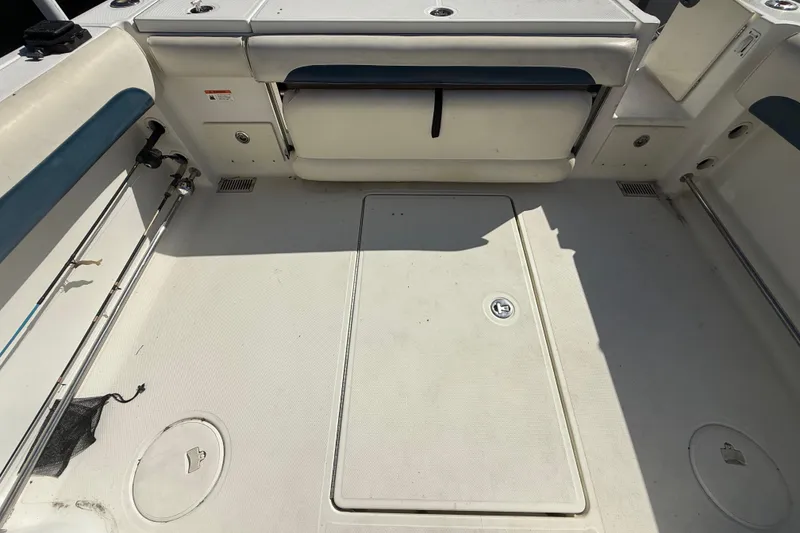 Slide: The Image of 2007 Hydra-Sports Vector 2900 VX boat deck with storage compartments and fishing rod holders. - 68