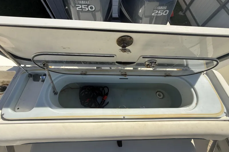 Slide: The Image of Open storage compartment on 2007 Hydra-Sports Vector 2900 VX boat with Yamaha 250 engines. - 75