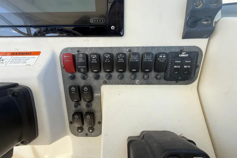 Slide: The Image of Control panel of a 2007 Hydra-Sports Vector 2900 VX boat with various switches. - 80