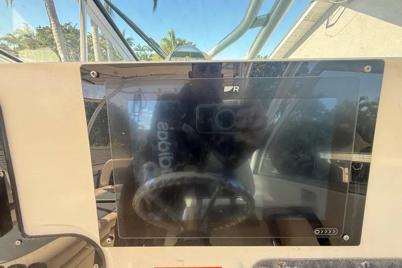 Slide: The Image of 2007 Hydra-Sports Vector 2900 VX dashboard with steering wheel and display screen. - 85