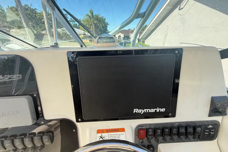Slide: The Image of 2007 Hydra-Sports Vector 2900 VX dashboard with Raymarine navigation system. - 86