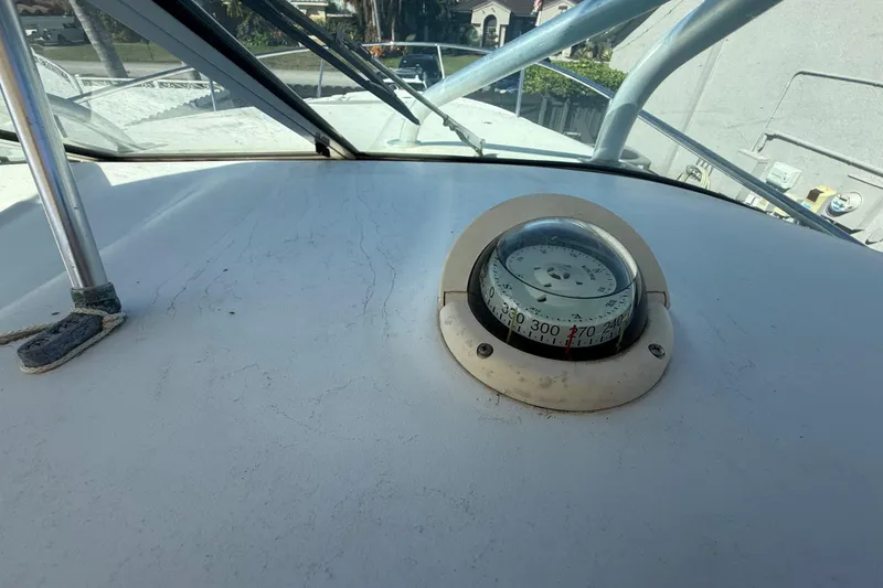Slide: The Image of 2007 Hydra-Sports Vector 2900 VX boat compass on deck, showcasing navigation equipment. - 88