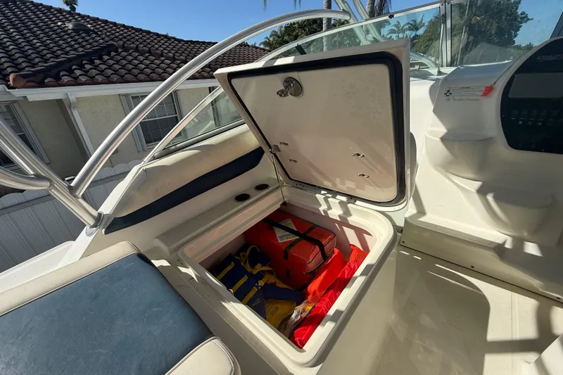 Slide: The Image of 2007 Hydra-Sports Vector 2900 VX boat storage compartment with safety gear and life jackets. - 90