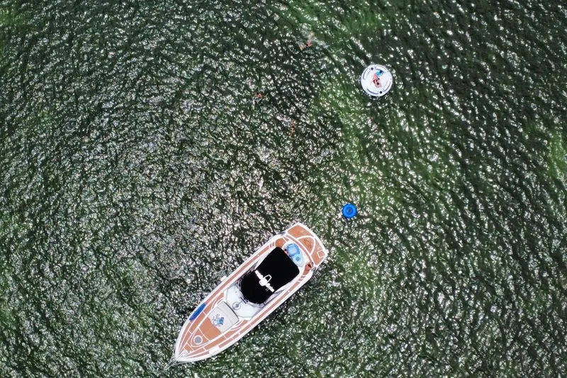 Slide: The Image of Aerial view of 2006 Sunseeker Portofino 47 yacht on shimmering water. - 10