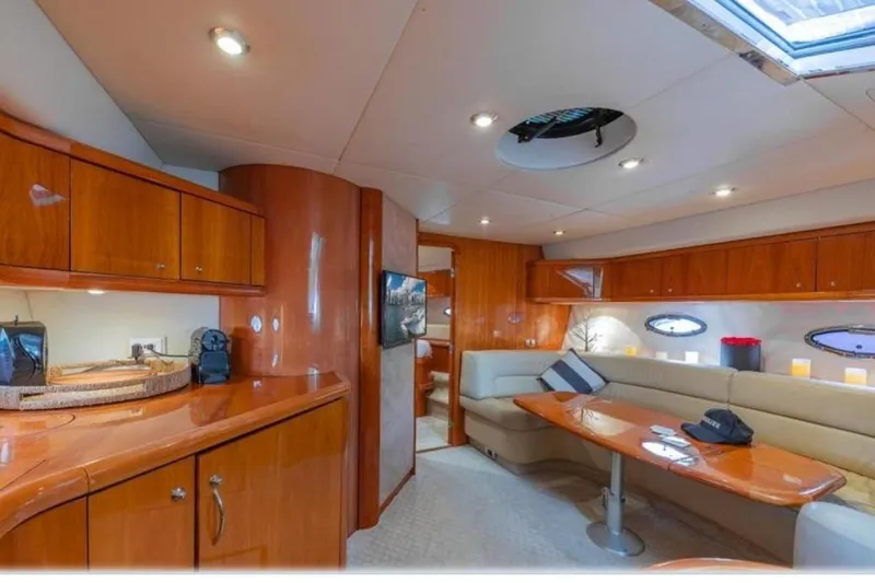 Slide: The Image of Luxurious interior of 2006 Sunseeker Portofino 47 yacht with elegant wood finishes. - 4