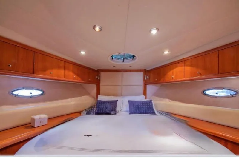 Slide: The Image of Luxurious cabin interior of 2006 Sunseeker Portofino 47 yacht with cozy bedding. - 5