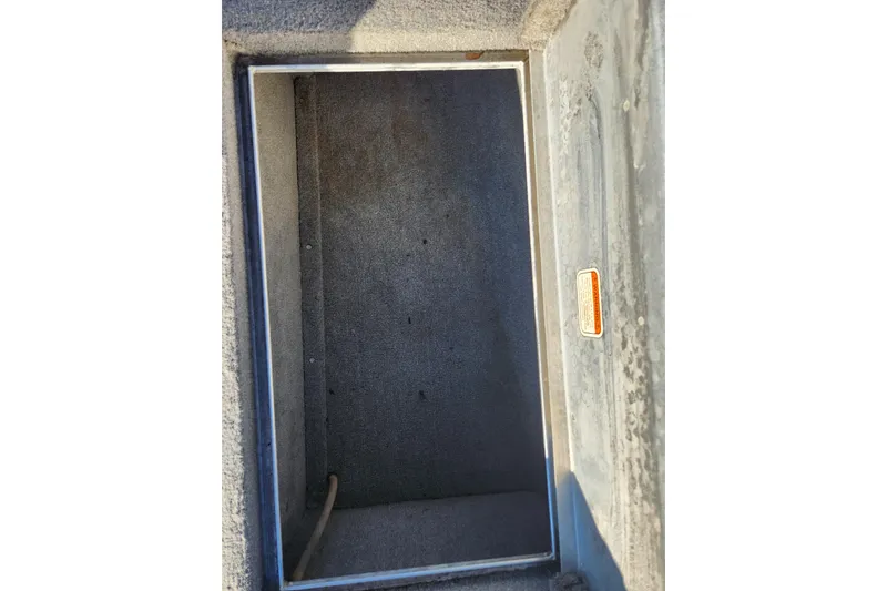 Slide: The Image of 2013 TRACKER MARINE Bass Tracker Pro Team 175 TWX storage compartment, open and empty. - 6