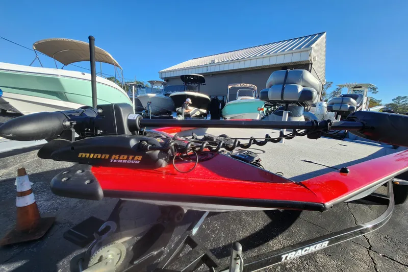 Slide: The Image of 2013 Bass Tracker Pro Team 175 TWX with Minn Kota Terrova motor in a marina setting. - 9