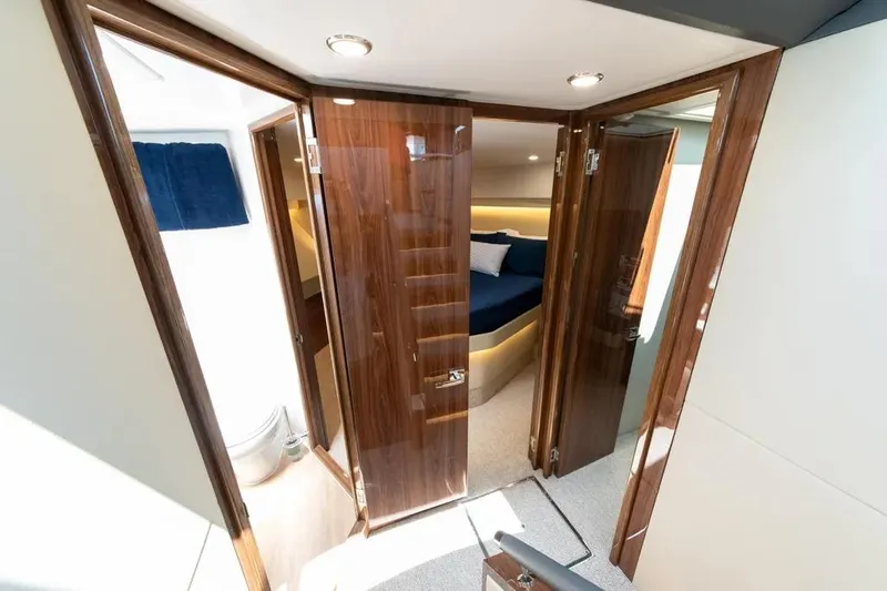 Slide: The Image of Luxurious interior of 2024 Maritimo M55 yacht with elegant wood finishes. - 12