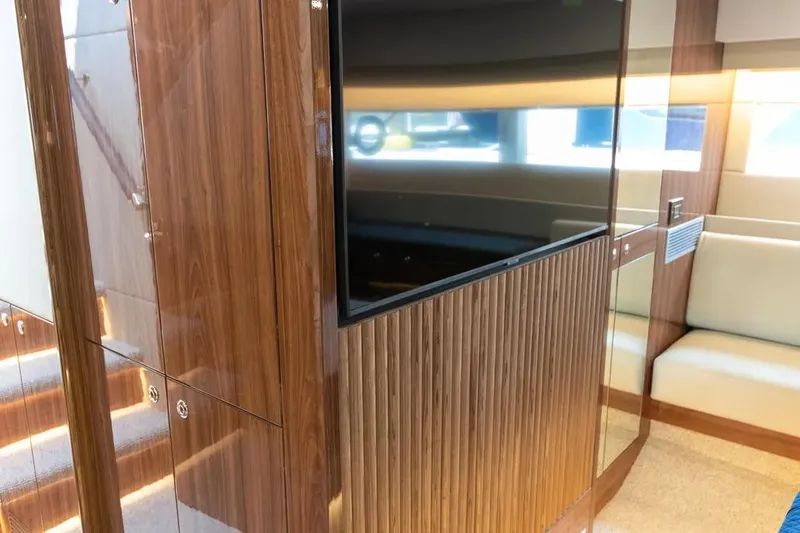 Slide: The Image of Luxurious interior of 2024 Maritimo M55 yacht with wood paneling and modern design. - 23