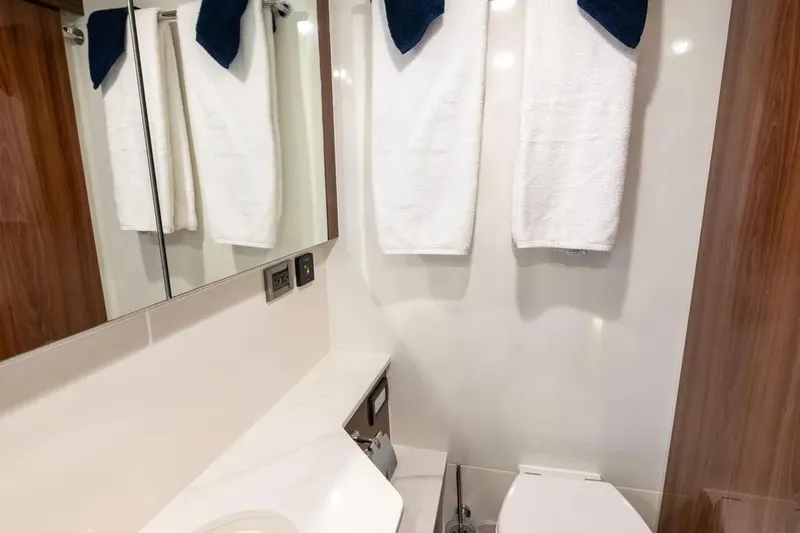 Slide: The Image of Luxurious bathroom in 2024 Maritimo M55 yacht with modern fixtures and elegant design. - 25