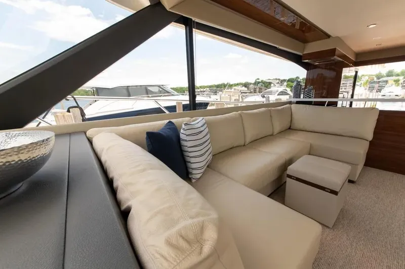 Slide: The Image of Luxurious interior of 2024 Maritimo M55 yacht with plush seating and scenic marina view. - 33