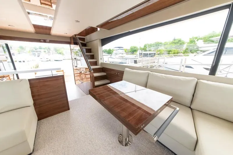 Slide: The Image of Luxurious interior of 2024 Maritimo M55 yacht with elegant seating and wooden accents. - 34