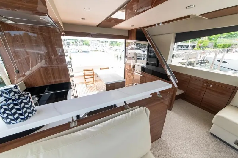 Slide: The Image of Luxurious interior of 2024 Maritimo M55 yacht with elegant wood finishes and modern design. - 35