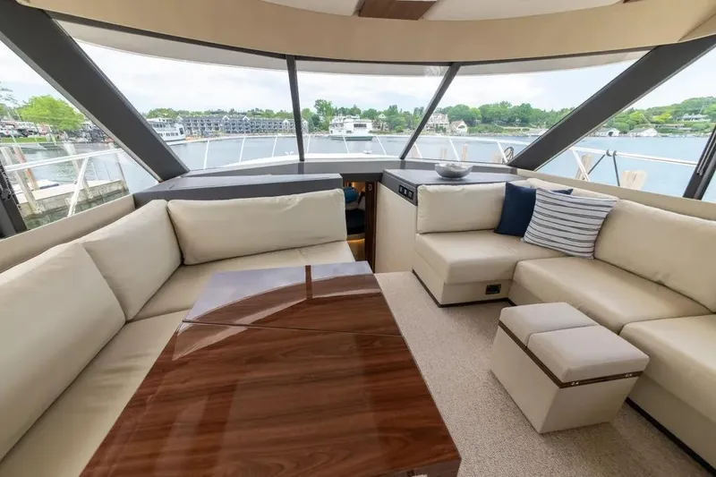 Slide: The Image of Luxurious interior of 2024 Maritimo M55 yacht with elegant seating and panoramic windows. - 40
