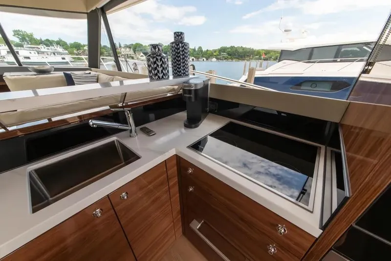Slide: The Image of Luxurious kitchen area on 2024 Maritimo M55 yacht with modern appliances and sleek design. - 44