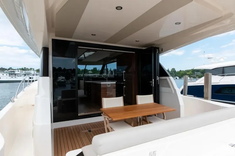 Slide: The Image of 2024 Maritimo M55 yacht with elegant outdoor seating and modern interior design. - 47
