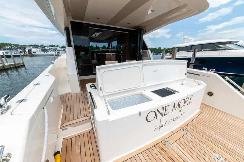 Slide: The Image of 2024 Maritimo M55 yacht with open deck, docked at marina. - 48