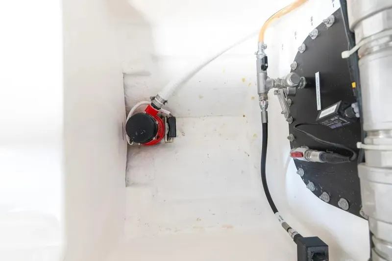 Slide: The Image of 2024 Maritimo M55 engine compartment with visible pump and piping system. - 54