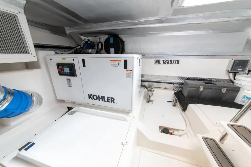 Slide: The Image of Engine room of 2024 Maritimo M55 yacht featuring Kohler generator. - 56