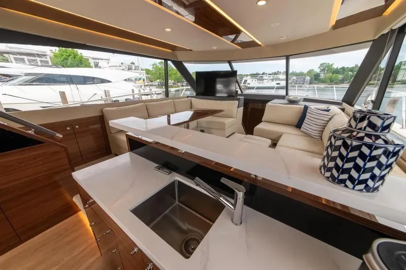 Slide: The Image of Luxurious interior of 2024 Maritimo M55 yacht with modern furnishings and panoramic windows. - 59