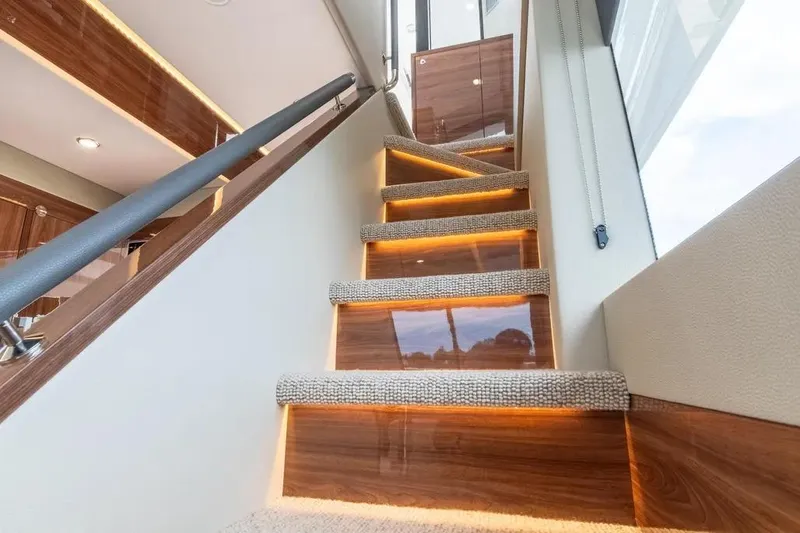Slide: The Image of Luxurious interior staircase of 2024 Maritimo M55 yacht with elegant lighting. - 60