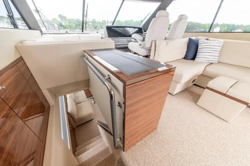 Slide: The Image of Luxurious interior of 2024 Maritimo M55 yacht with plush seating and elegant wood finishes. - 61