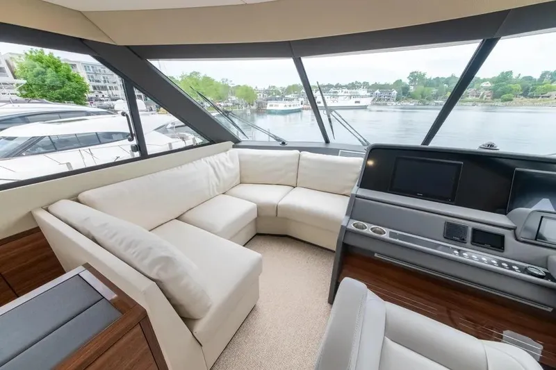 Slide: The Image of Luxurious interior of 2024 Maritimo M55 yacht with panoramic windows and plush seating. - 63