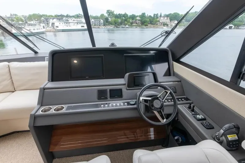 Slide: The Image of 2024 Maritimo M55 yacht helm with modern controls and panoramic view. - 66